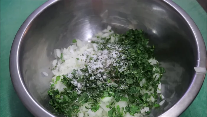 Add salt, red sumac, black pepper, ground cumin, sweet paprika, ground cinnamon, ground cardamom, and crushed garlic to the bowl.