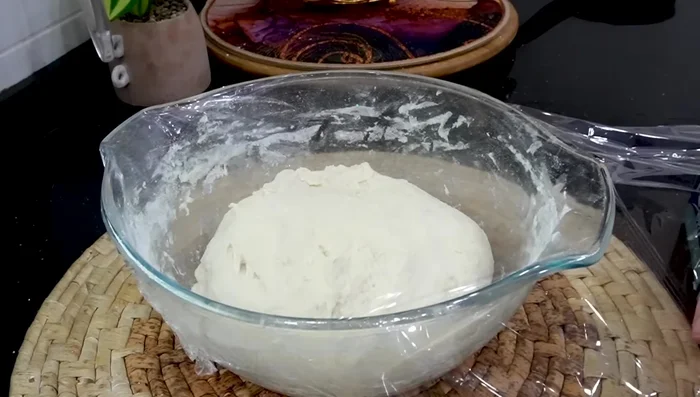 Cover the dough with a plastic bag and let it rest for at least 30 minutes, or until doubled in size.