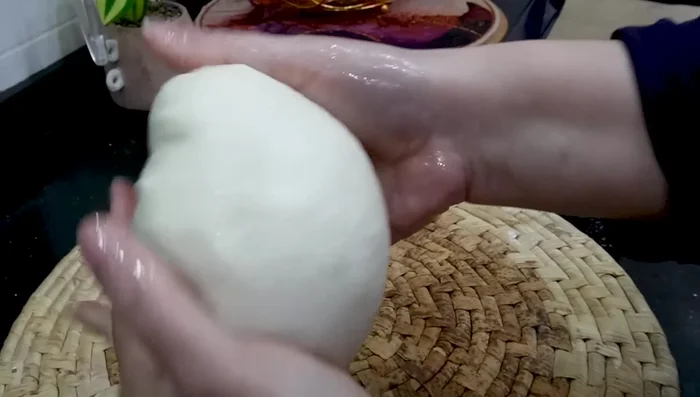 Shape each portion into a loaf. Lightly oil the surface of each loaf.