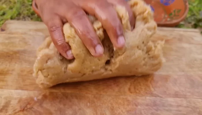 Shape the chicken mixture into nuggets. You can use a lid or your hands to shape them.