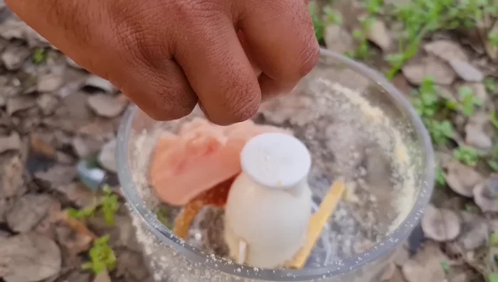 Grind the chicken in a food processor.