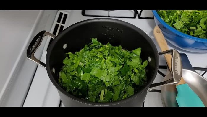 While the meat cooks, prepare the spinach: Add half the spinach to the pot and cook over low heat, stirring occasionally, until wilted. Repeat with the remaining spinach.