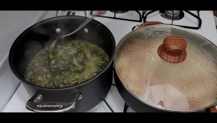 Serve the spinach stew over the cooked rice.