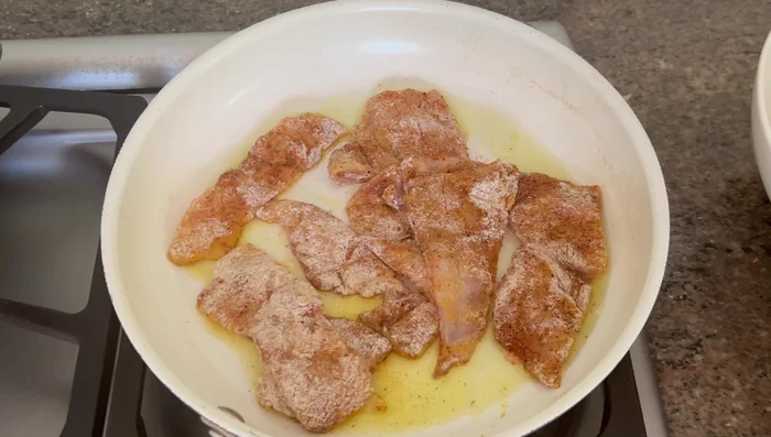 Pan-fry the fish until golden brown on both sides using avocado oil. Don't fully cook it yet.