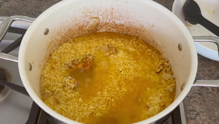 Add 3 cups of chicken broth and 1 cup of water. Bring to a boil, cover, and simmer for 20 minutes.