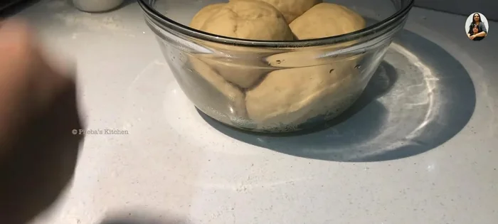 Roll out the dough: Sprinkle flour on your surface and roll each ball into a thin disc.