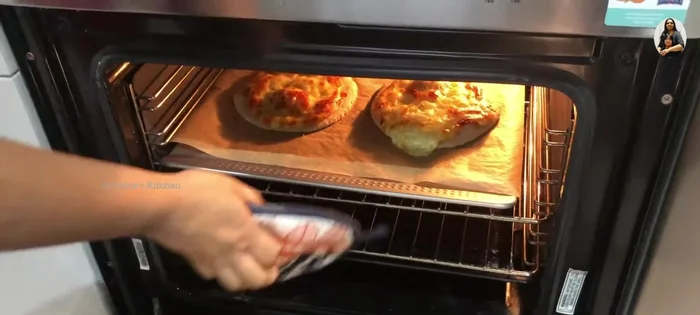 Bake the Lamb Manakish: Bake for 20 minutes.