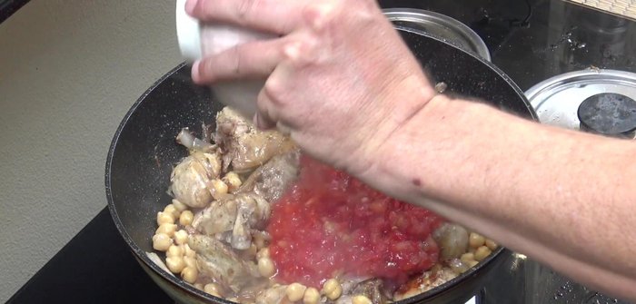 Add the chopped tomatoes, cumin powder, and chili powder.