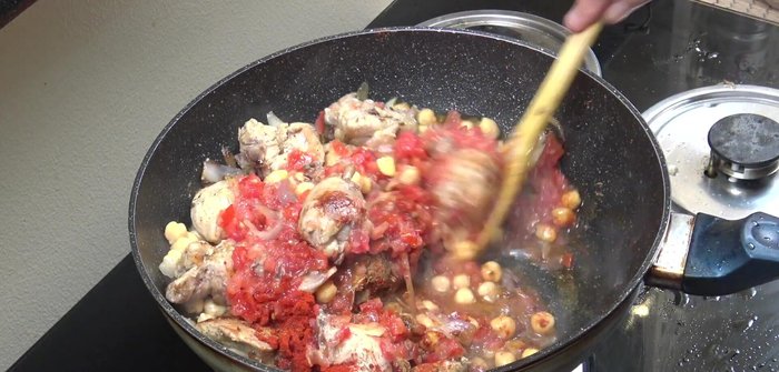 Simmer over medium heat for 8 minutes, stirring occasionally, until tomatoes are cooked down.