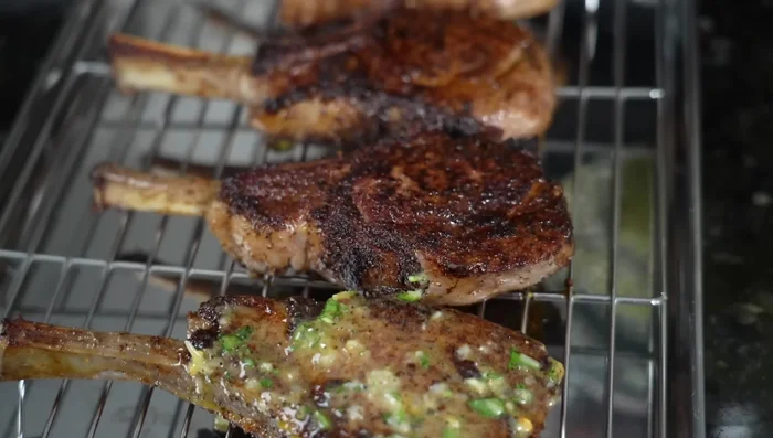 Prepare the sauce: Drain excess oil from the skillet. Add diced shallot and minced garlic, cook until softened. Add compound butter and deglaze with white wine. Stir in parsley and lemon juice. Simmer for a couple of minutes to cook off the alcohol.