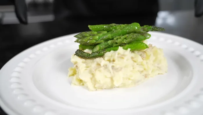 Plate the lamb chops with your desired sides (mashed potatoes and asparagus are suggested). Drizzle the sauce over the lamb chops.