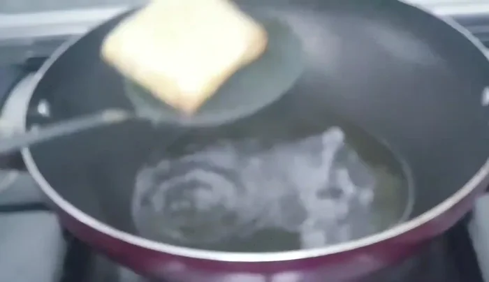 Add the chicken parcels to the pan with oil and fry until golden brown on both sides for 3 minutes.