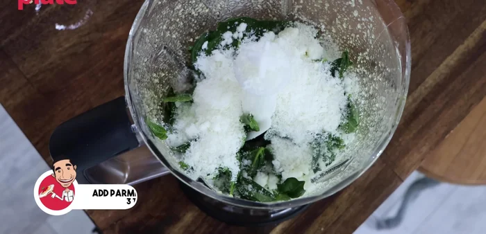 Incorporate cheese and salt: Add Parmesan cheese and a pinch of salt. Blend for about 30 seconds.