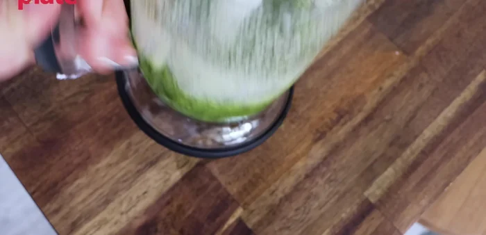 Adjust consistency: Use a spoon to scrape down the sides of the blender, ensuring all ingredients are incorporated. Taste and adjust with more olive oil, cheese, or salt as needed.