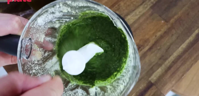 Mix by hand: Finish mixing the pesto by hand to ensure a smooth and even consistency.
