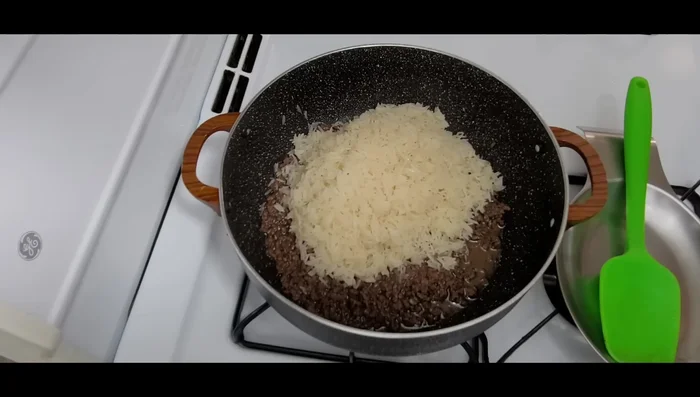 Add 2 cups of washed rice, remaining spices, and 4 cups of filtered chicken broth. Bring to a boil, reduce heat, cover, and simmer until all liquid is absorbed and rice is cooked (about 23 minutes).