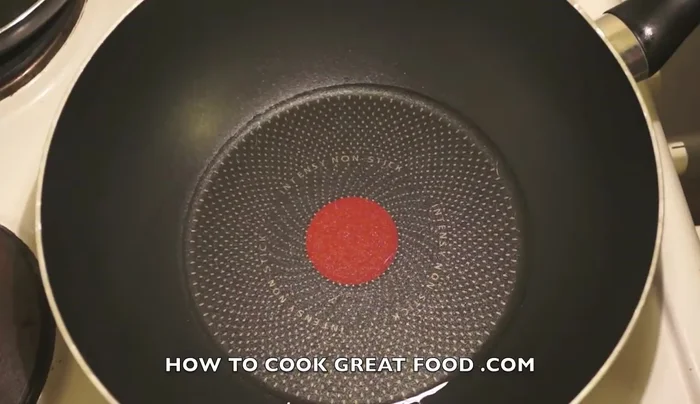 Heat sunflower oil in a pan. Add sliced onions, garlic, black pepper, and salt.