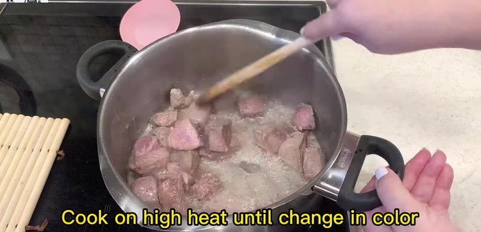 Brown the meat in a pot with olive oil until lightly browned. Add boiling water and seasonings (sugar included). Simmer until the meat is fully cooked.