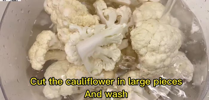 While the meat simmers, cut the cauliflower into large pieces and wash thoroughly.