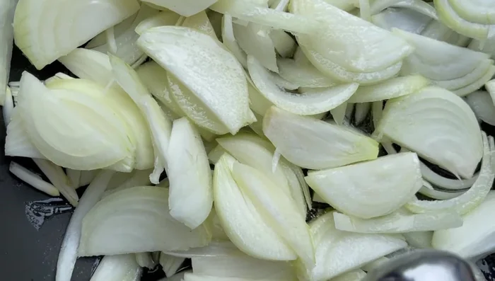 While lentils simmer, slice 3 onions into thin ribbons. Add 1/2 cup of olive oil and salt to a non-stick pan. Caramelize onions over medium-high heat, then reduce to low and cook for about 30 minutes, stirring occasionally to prevent burning.