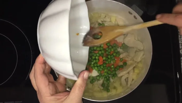 Add the peas and carrots (fresh or frozen, washed and drained). Sauté until everything is well combined.