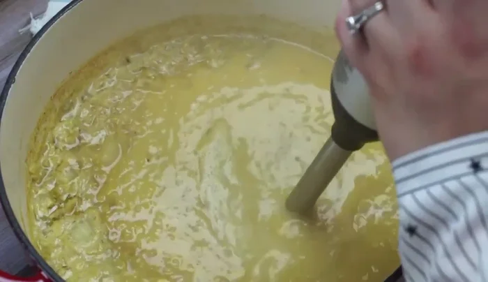 Use an immersion blender to blend the soup until smooth. Blend in short bursts (1-2 seconds) to prevent splattering.