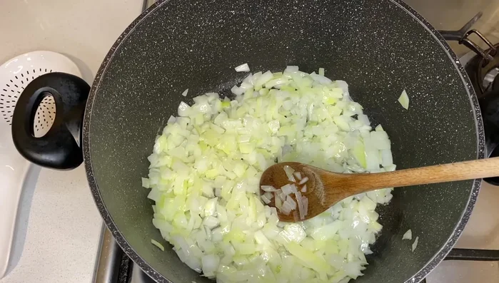 Add the diced onion to a pot.