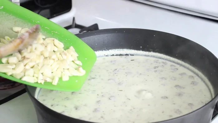 Add the chopped garlic. Reduce heat and simmer for a couple of minutes.