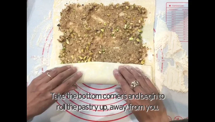 Roll up the pastry from the bottom, tightly.