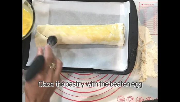 Brush the pastry with the egg wash.