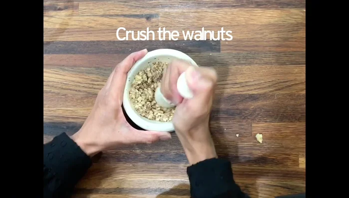 Crush walnuts and pistachios. Aim for a coarse crush; avoid large chunks or fine powder.