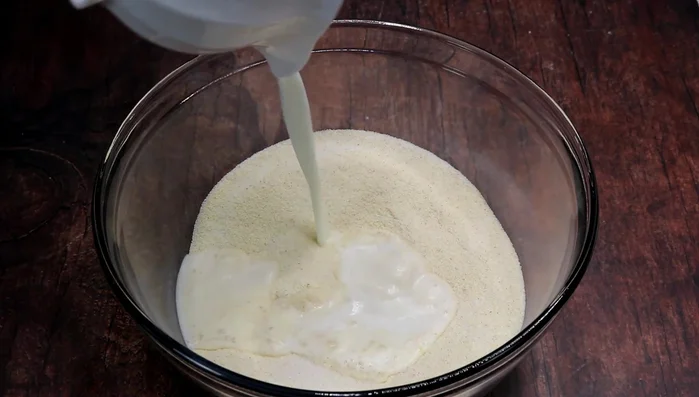 Mix semolina, granulated sugar, baking powder, and milk.