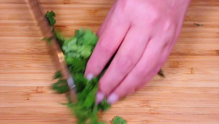 Chop cilantro and parsley.