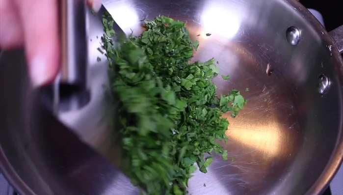 Add herbs and spices (paprika, black pepper, harissa, cumin) to the steamed eggplant.