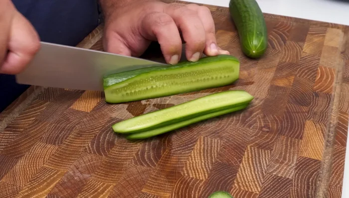 For Shirazi Salad: Finely dice cucumbers and tomatoes. Dice red onion.