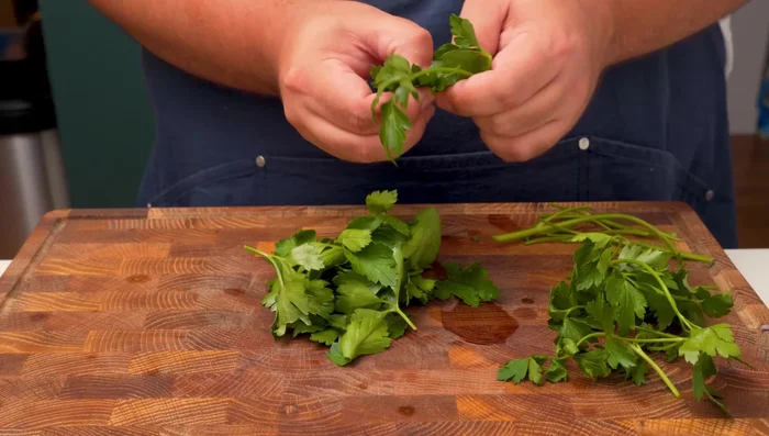 Finely mince parsley, removing tough stalks.