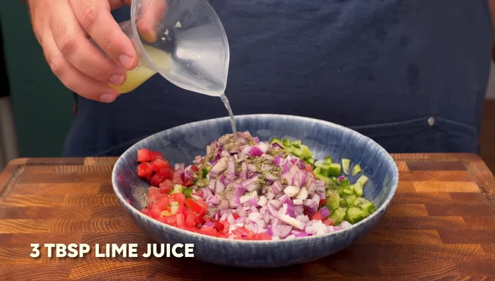 Dress with lime juice and olive oil. Mix well. (Shirazi Salad)