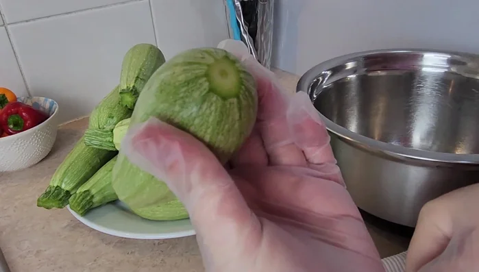 Slice the tops and bottoms off the zucchinis. Use a zucchini corer or knife to scoop out about 60% of the insides, leaving a shell.