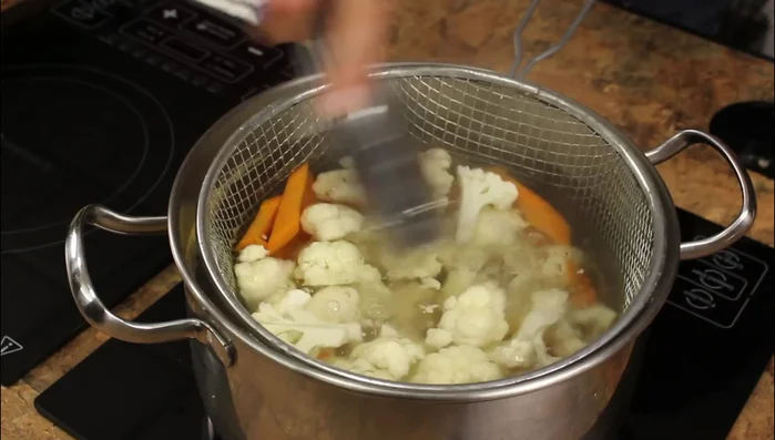 Immediately transfer the cooked vegetables to an ice bath to stop the cooking process.
