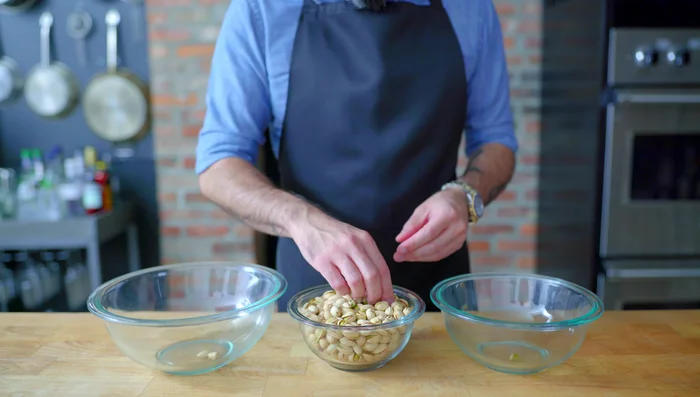 Prepare the nut mixture: Pulse pistachios (or other nuts) in a food processor until finely chopped but with some visible chunks. Add sugar and cinnamon, pulse to combine.