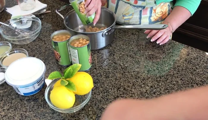Warm the garbanzo beans: Heat the canned garbanzo beans in a pot until boiling. Add ½ teaspoon of salt.