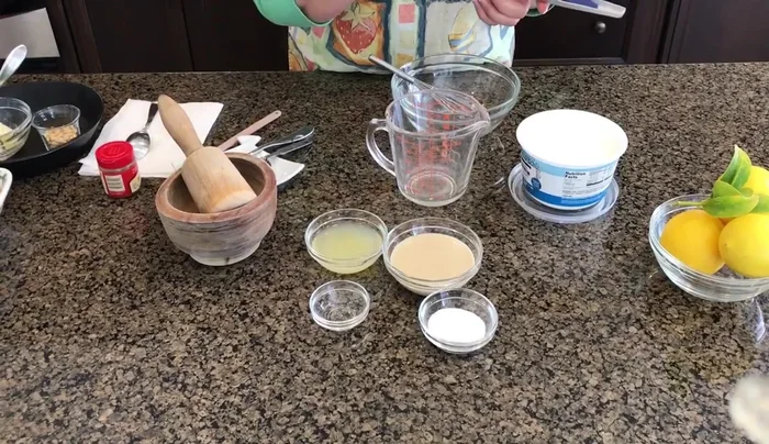 Crush the garlic: Crush 3 cloves of garlic using a garlic press or mortar and pestle.