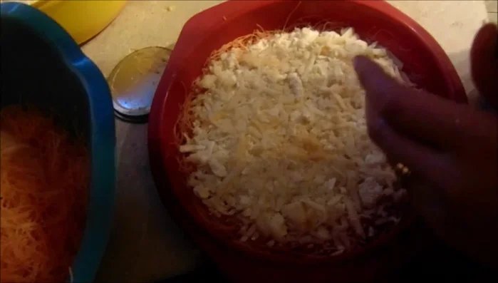 Add another layer of the prepared phyllo dough on top of the cheese and press it down firmly.