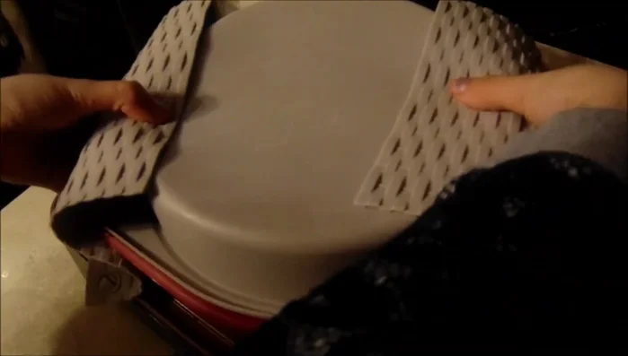 Carefully flip the knafeh and cook the other side until lightly browned and soft.