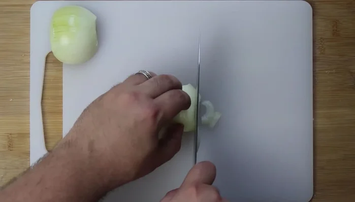 Prepare the fillings: Chop onions. For spinach filling, thinly slice half the onion and cure with salt. For meat filling, dice the remaining onion. Toast pine nuts.