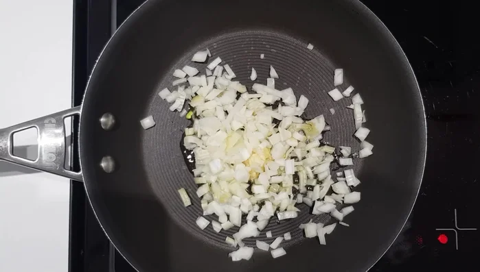 Cook meat filling: Cook diced onion and garlic, then add minced beef. Brown and break up the beef. Add pine nuts and seasoning. Set aside to cool.