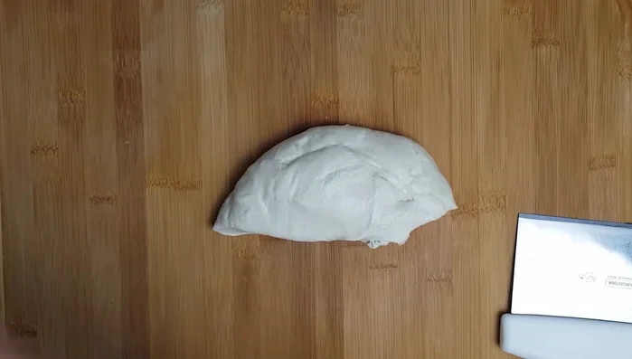 Roll out the dough: Divide the dough into quarters. Roll each quarter into a thin rectangle. Use a cutter to make circles.