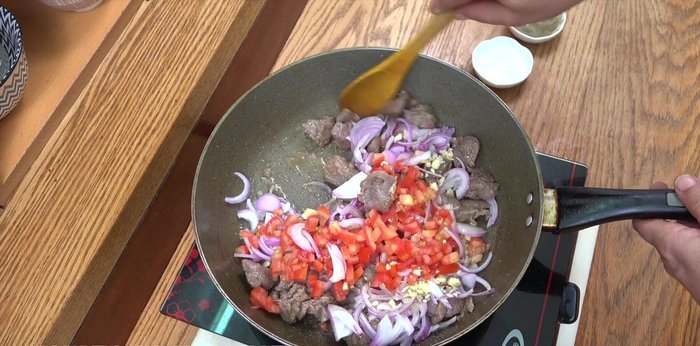 Add the chopped tomatoes and continue to cook for about 5 minutes until softened.