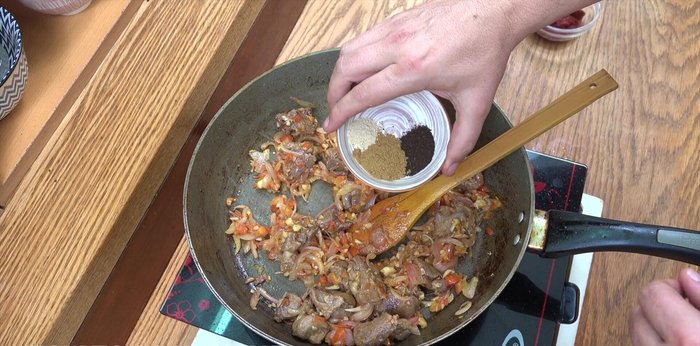 Add cumin powder, black lemon powder, and green cardamom powder. Stir well and cook for 5 minutes.