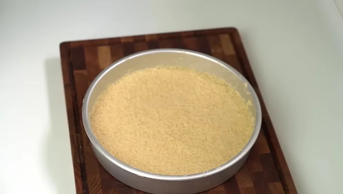Pre-bake the kunafa base in a 200°C oven for 15 minutes until golden brown.